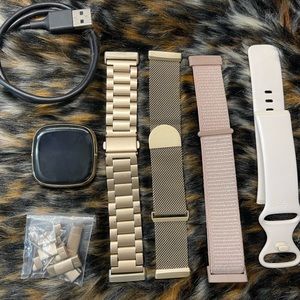 EUC FITBIT Sense with charger and 4 bands